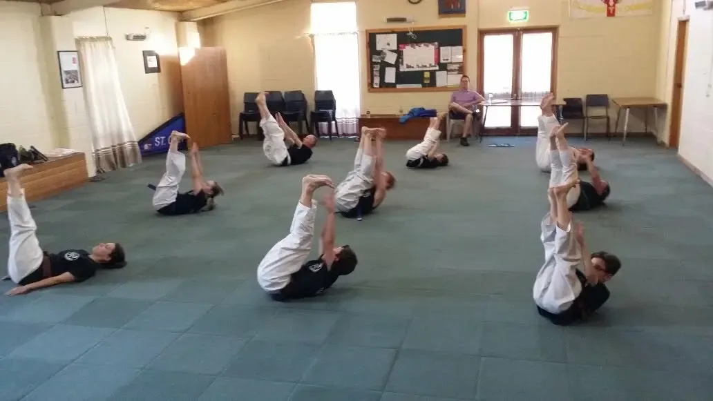 Elizabeth Downs Taekwondo students line up in gym