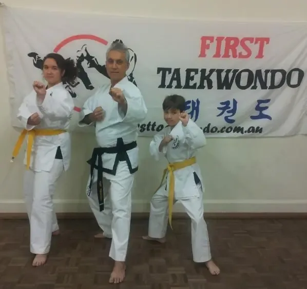Family practicing Taekwondo together