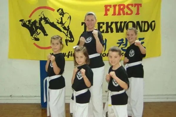 Family members receiving belt awards together