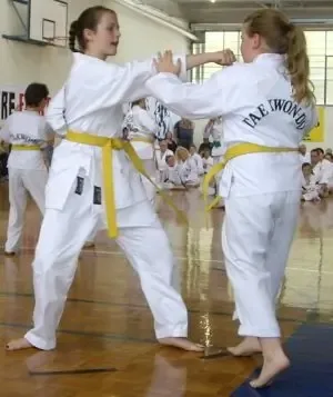 Female students executing kick drills