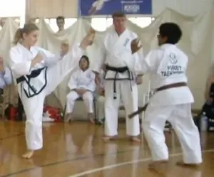 Women practicing blocking technique